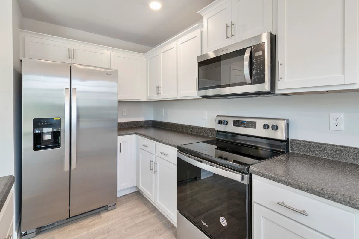 Pre-assembled kitchen cabinets installed in a bright kitchen